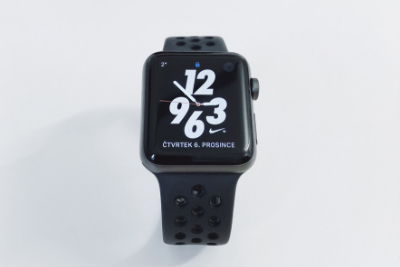 Apple Watch Series 5 with black band, nike screen, and a white background.